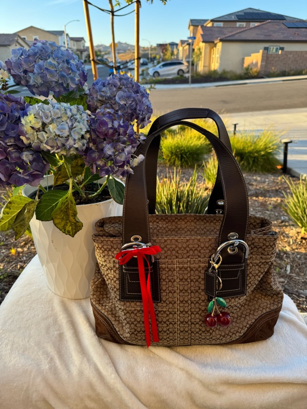 Coach Brown Signature Tote with Cherry Charm and Red Ribbon